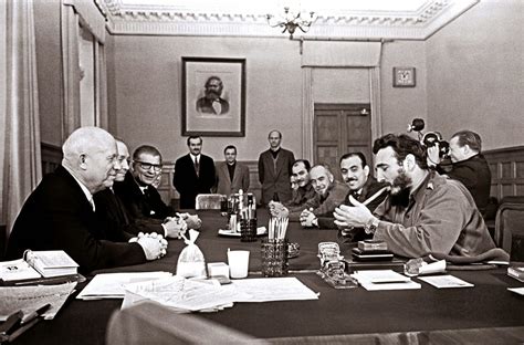 Fidel Castro smoking a cigar and wearing two Rolex watches 